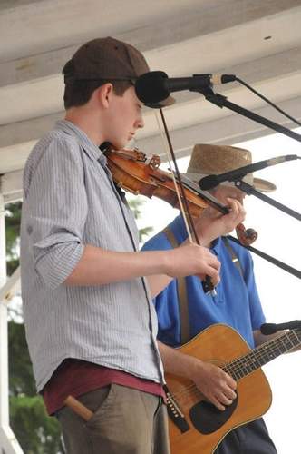 Max playing fiddle with Michael playing guitar.